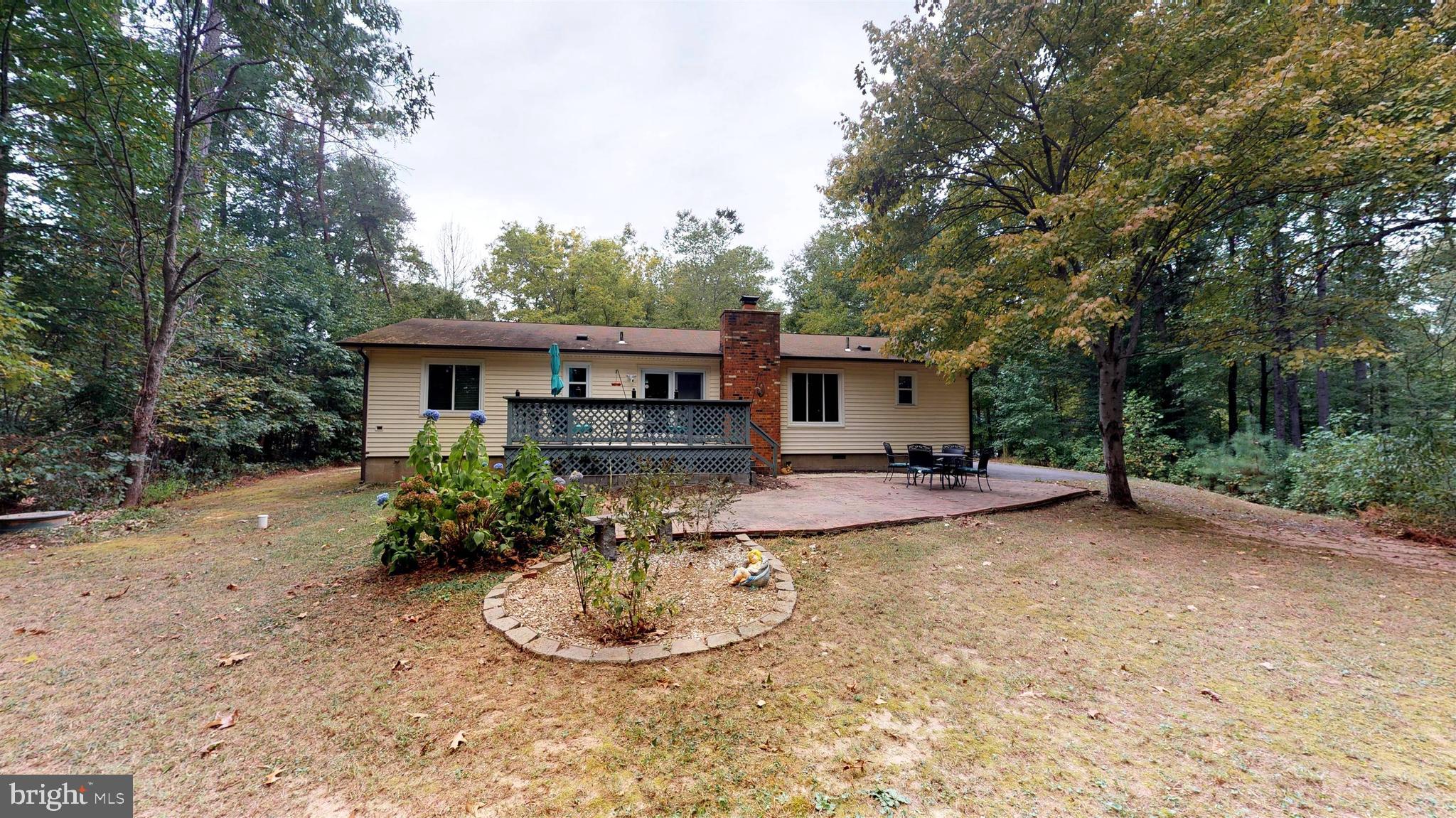 919 Swan Lane Ruther Glen, VA 22546 - Photo 4 of 30 Rear of home with deck and brick patio