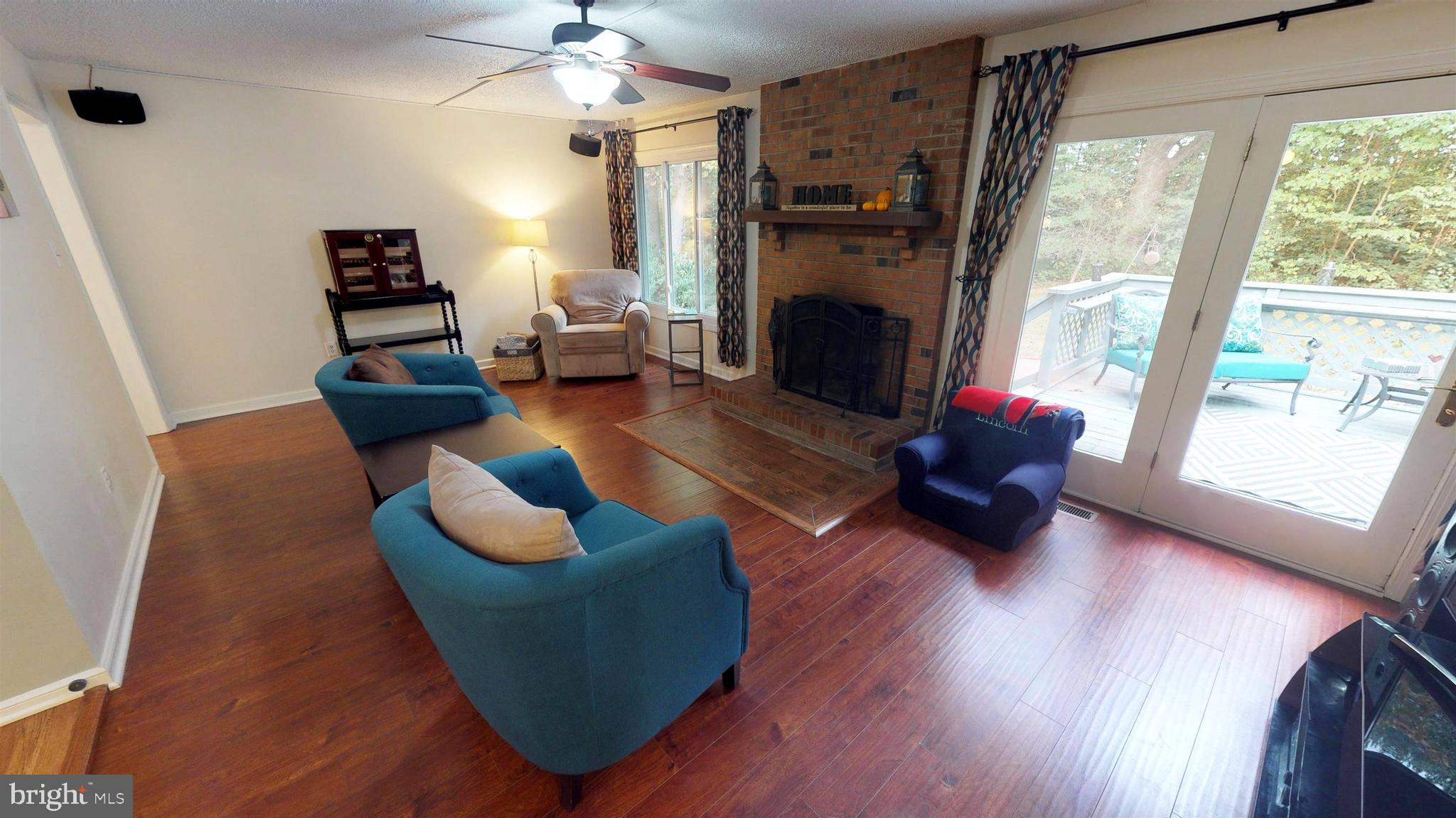 919 Swan Lane Ruther Glen, VA 22546 - Photo 5 of 30 Living Room with Brick Wood Burning Fireplace
