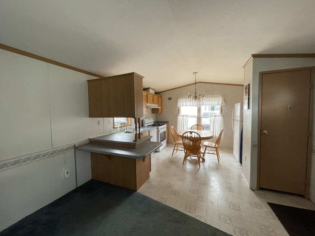 268 Palmer Road, Unit 12 Monson, MA 01057 - Photo 7 of 15 a dining room with furniture and window