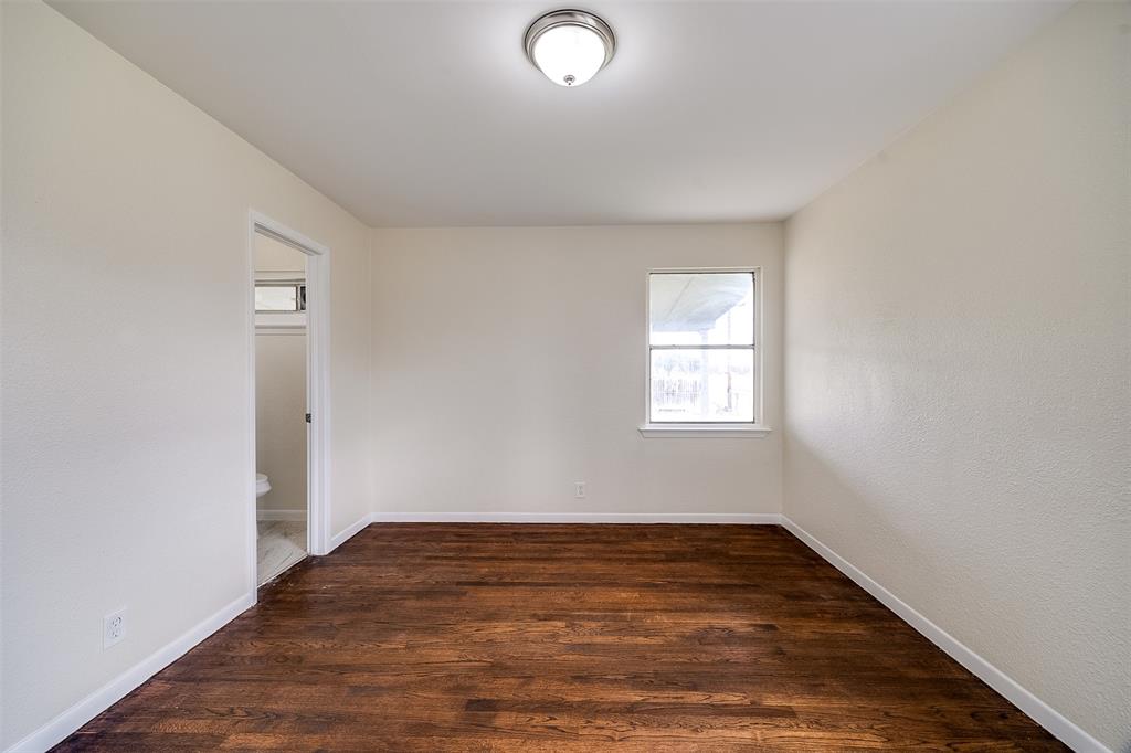 3071 Larry Drive Dallas, TX 75228 - Photo 15 of 16 an empty room with wooden floor and windows