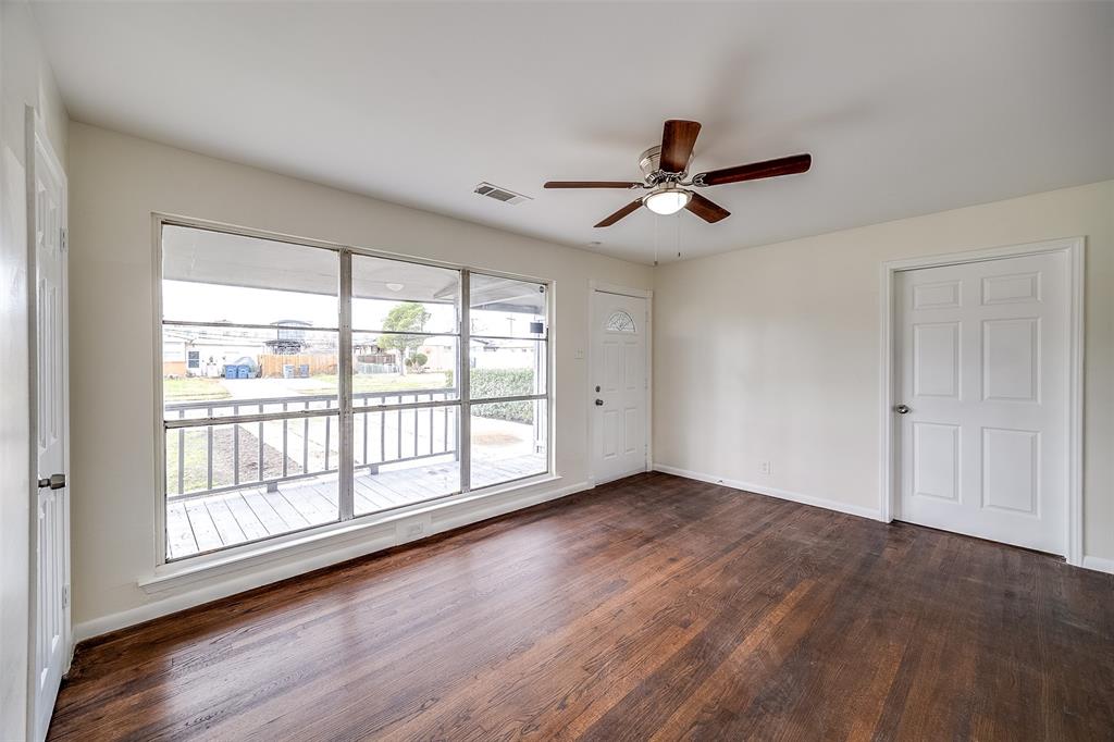 3071 Larry Drive Dallas, TX 75228 - Photo 4 of 16 wooden floor in an empty room with a window