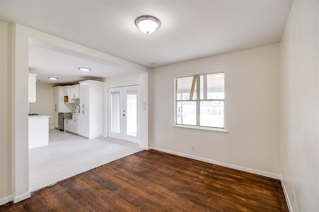 3071 Larry Drive Dallas, TX 75228 - Photo 6 of 16 wooden floor in an empty room with a window