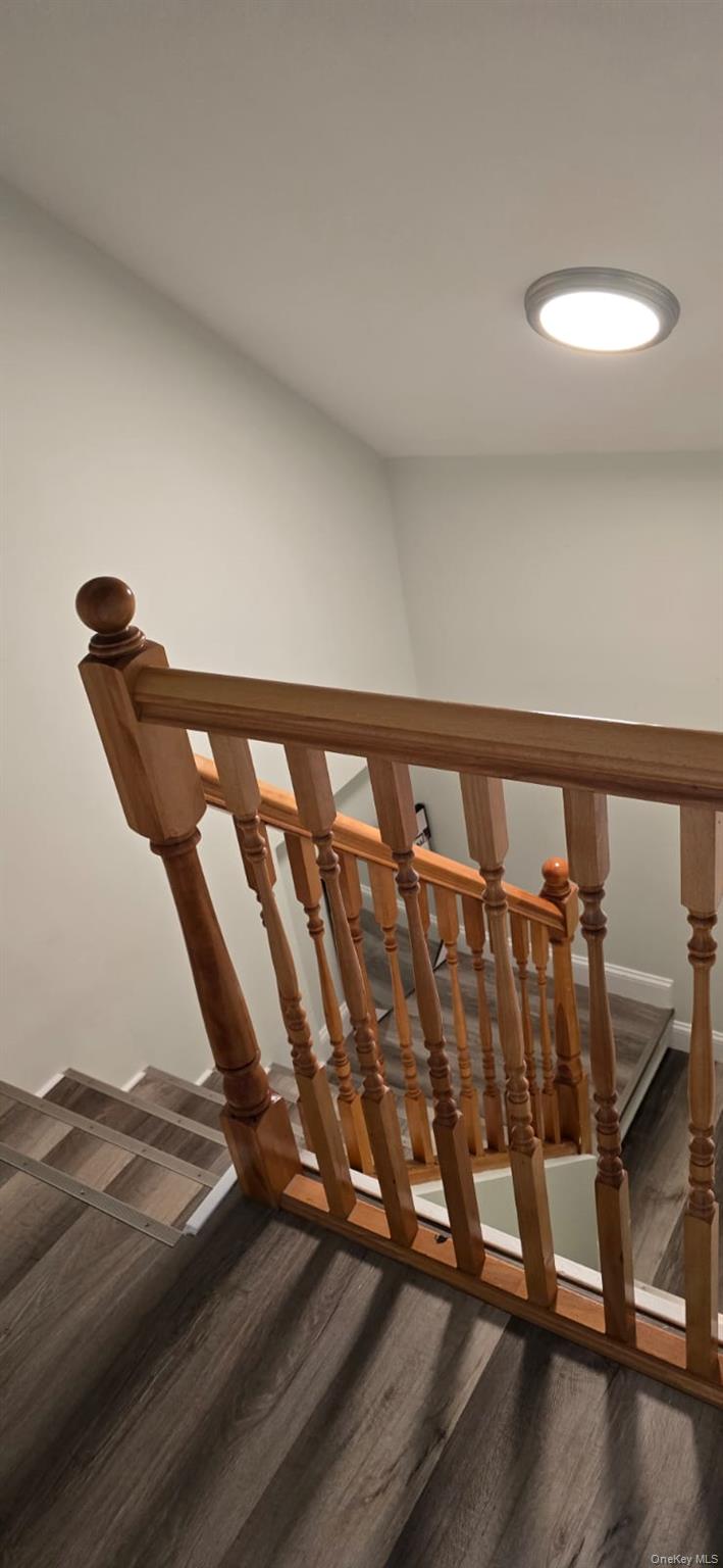 235 MacDougal Street Brooklyn, NY 11233 - Photo 20 of 21 Staircase featuring wood finished floors
