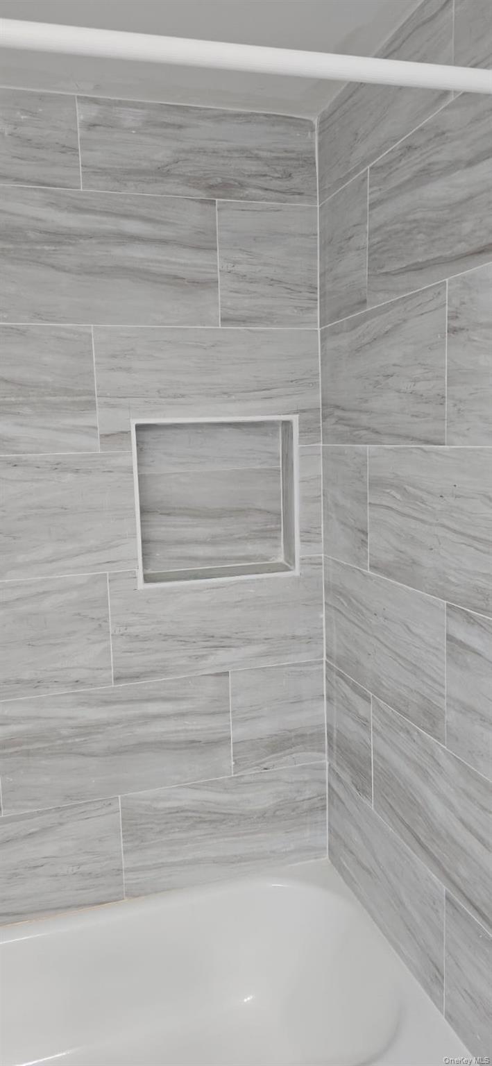 235 MacDougal Street Brooklyn, NY 11233 - Photo 5 of 21 Bathroom with tiled shower