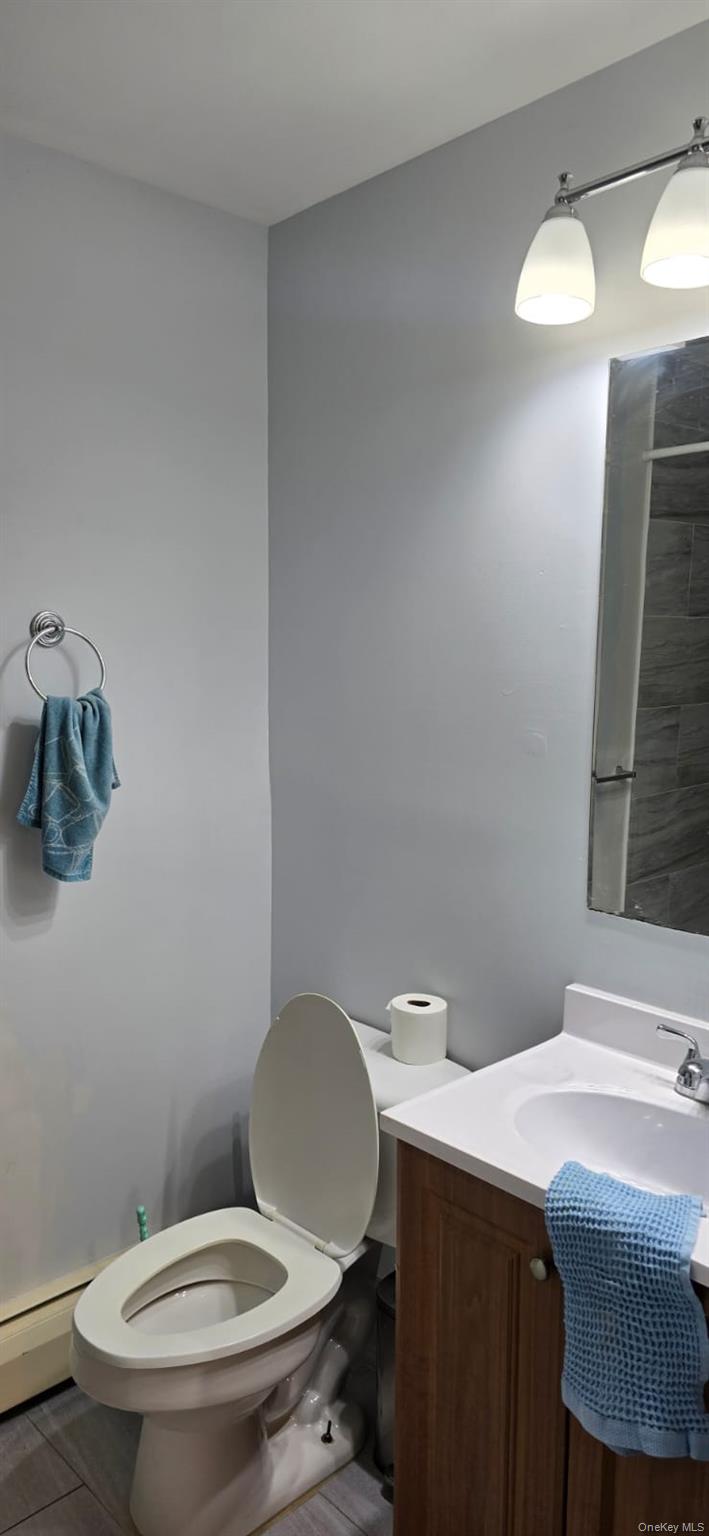 235 MacDougal Street Brooklyn, NY 11233 - Photo 9 of 21 Bathroom featuring vanity and toilet