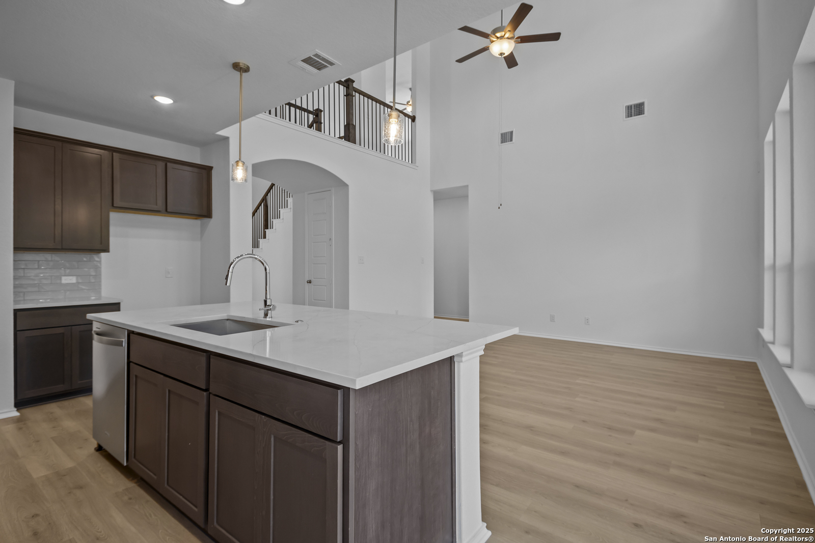 517 Foxtail Canyon Cibolo, TX 78108 - Photo 11 of 38 a kitchen with a sink a refrigerator and cabinets