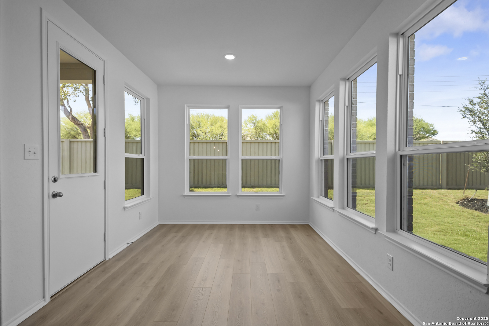 517 Foxtail Canyon Cibolo, TX 78108 - Photo 12 of 38 a view of an empty room with wooden floor and a window