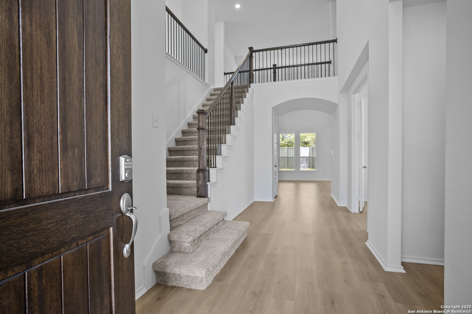 517 Foxtail Canyon Cibolo, TX 78108 - Photo 4 of 38 a view of entryway with wooden floor and stairs