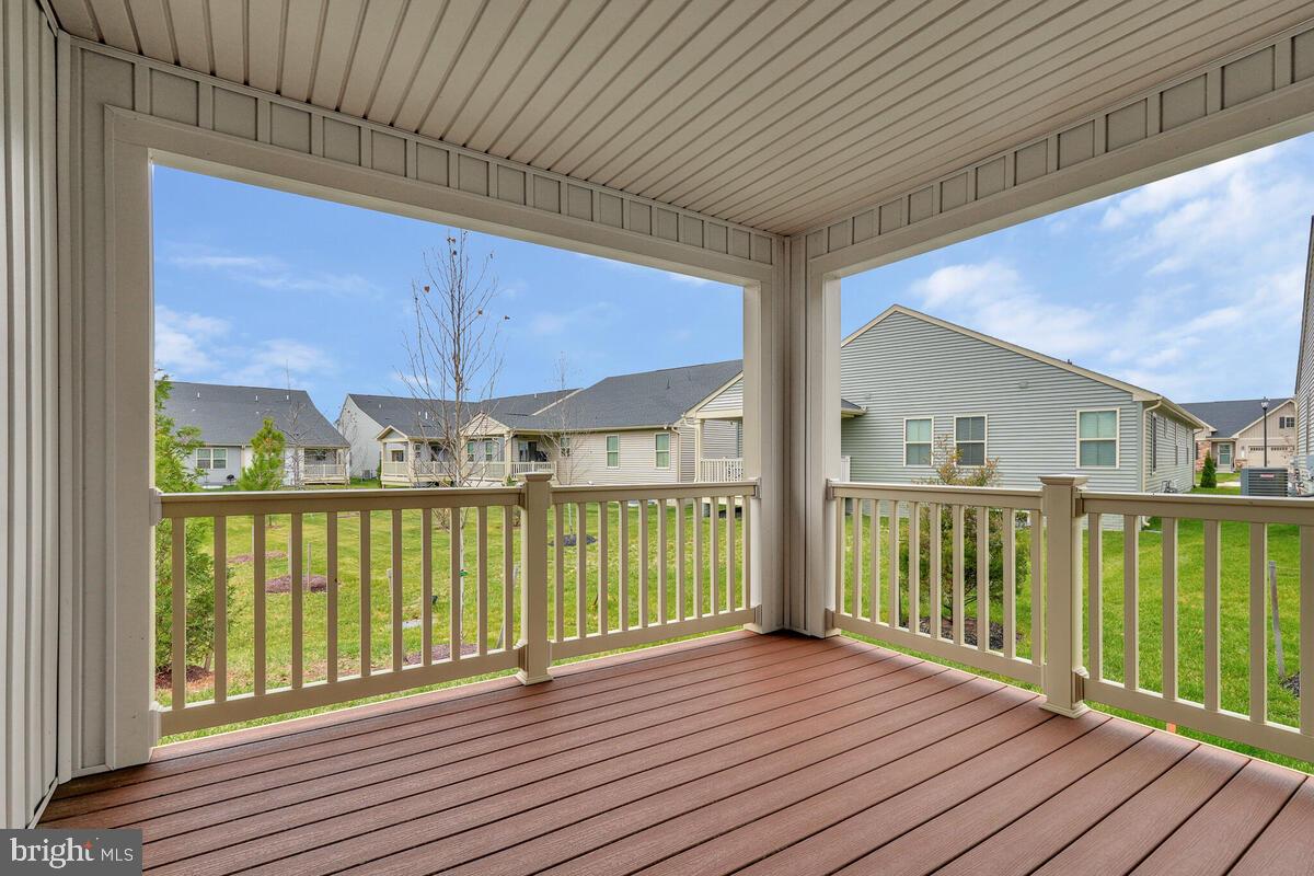14380 Longhouse Loop Brandywine, MD 20613 - Photo 15 of 35 a view of a balcony with wooden floor