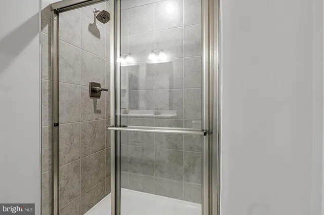 a bathroom with a glass shower door