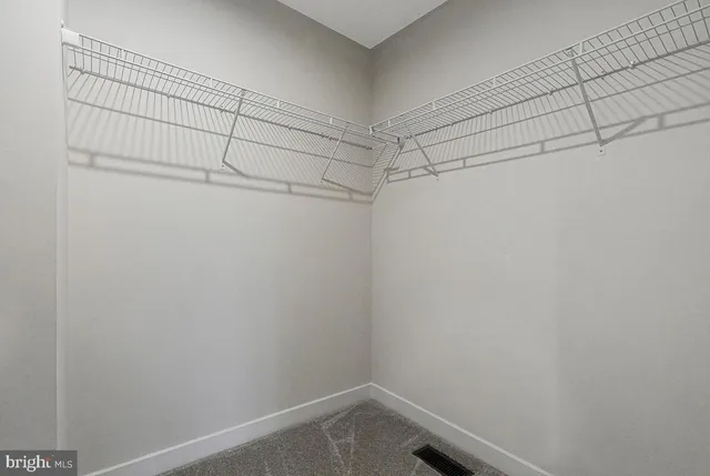 a view of a room with racks on the wall