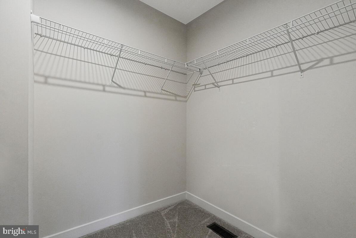 14380 Longhouse Loop Brandywine, MD 20613 - Photo 21 of 35 a view of a room with racks on the wall