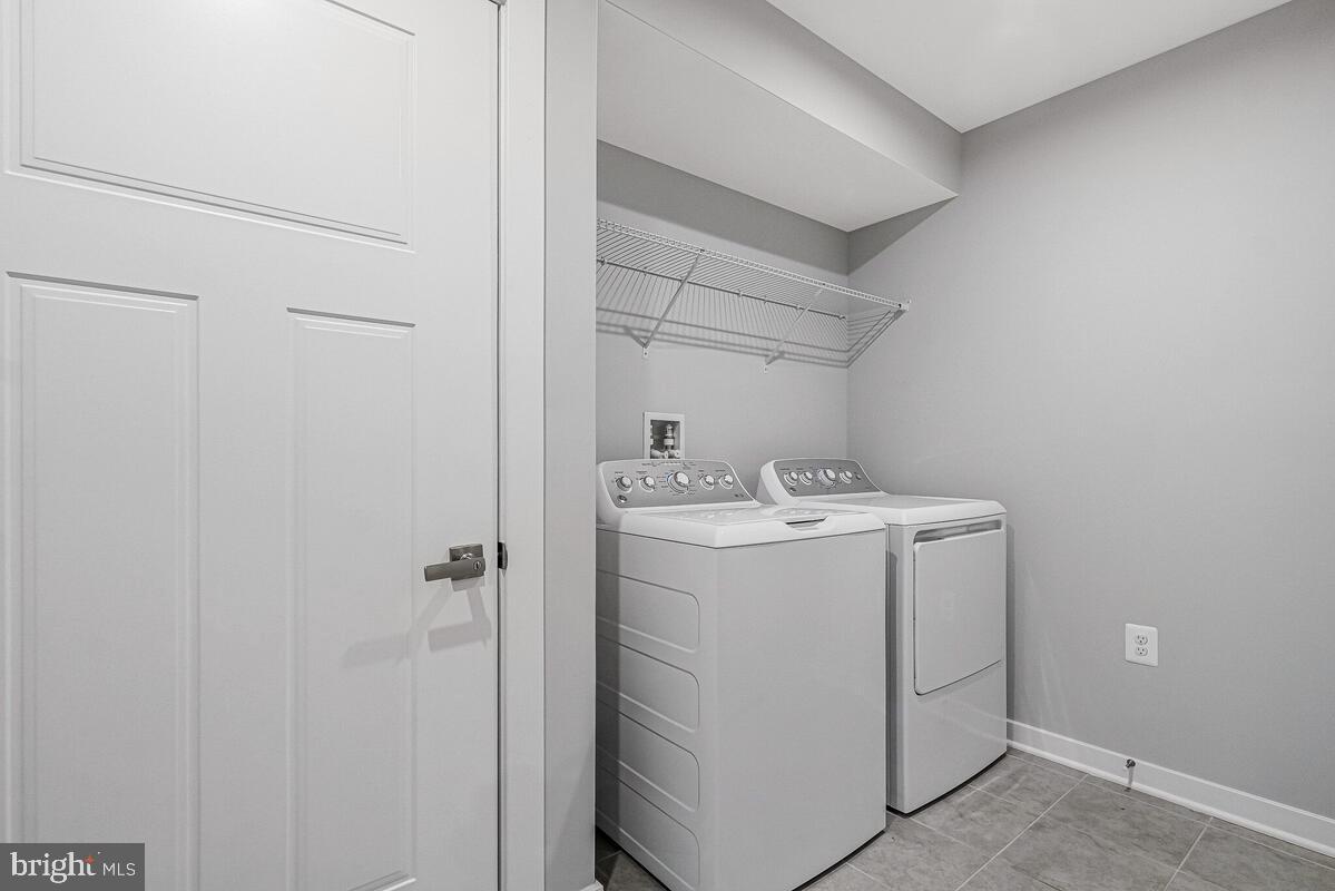 14380 Longhouse Loop Brandywine, MD 20613 - Photo 22 of 35 a utility room with dryer and washer