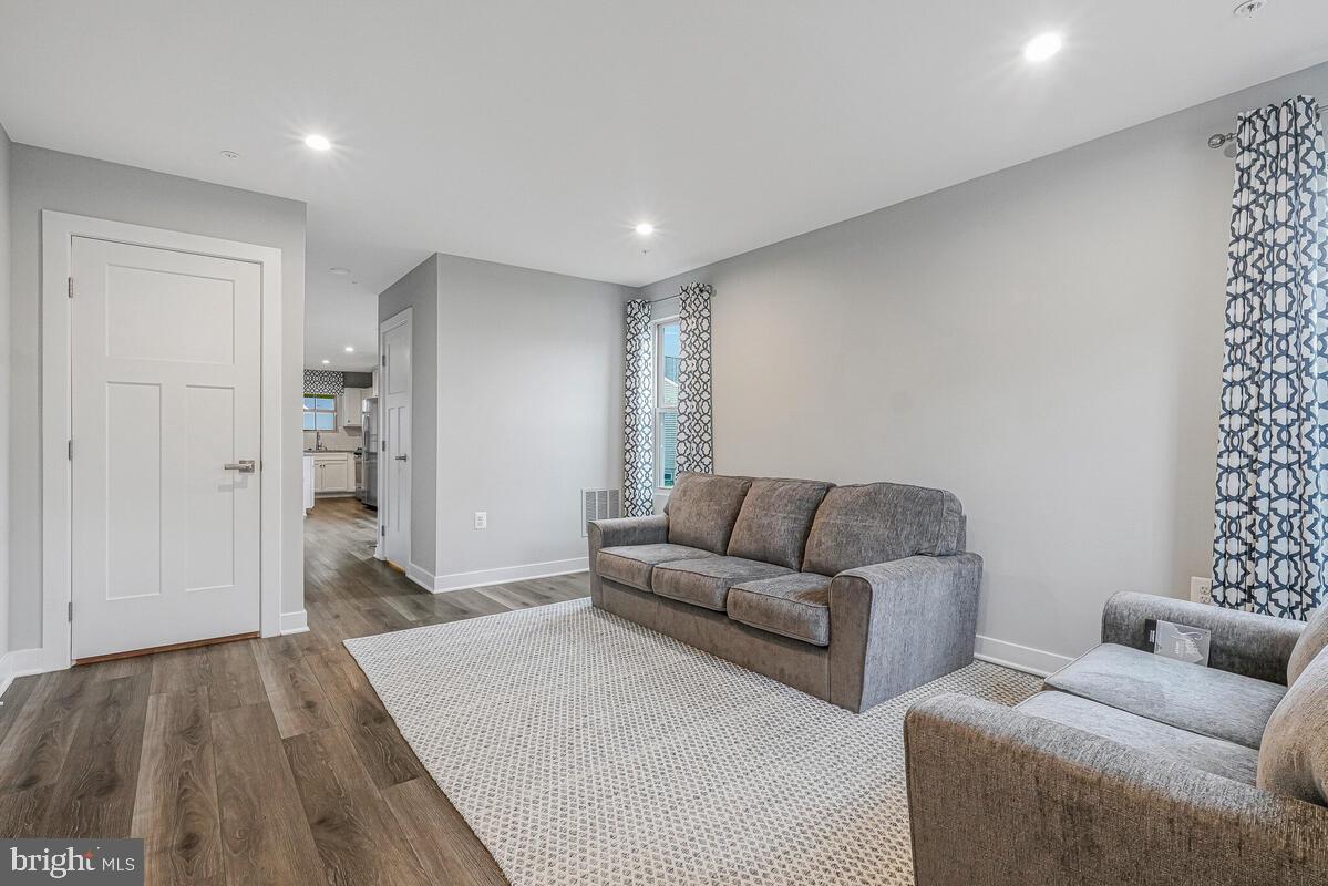 14380 Longhouse Loop Brandywine, MD 20613 - Photo 4 of 35 a living room with furniture and a wooden floor