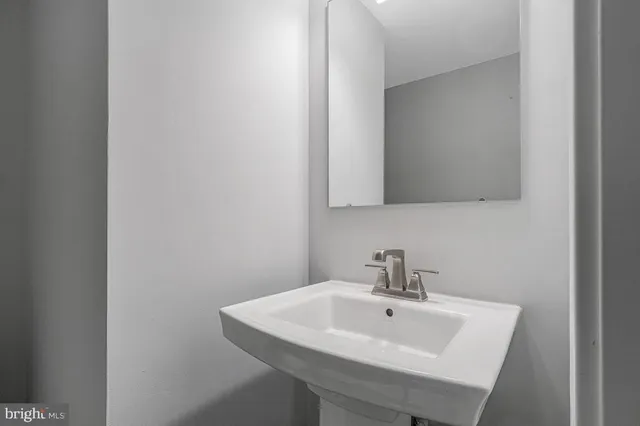 a white sink sitting next to a white sink