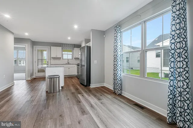 a kitchen with a table and chairs in it