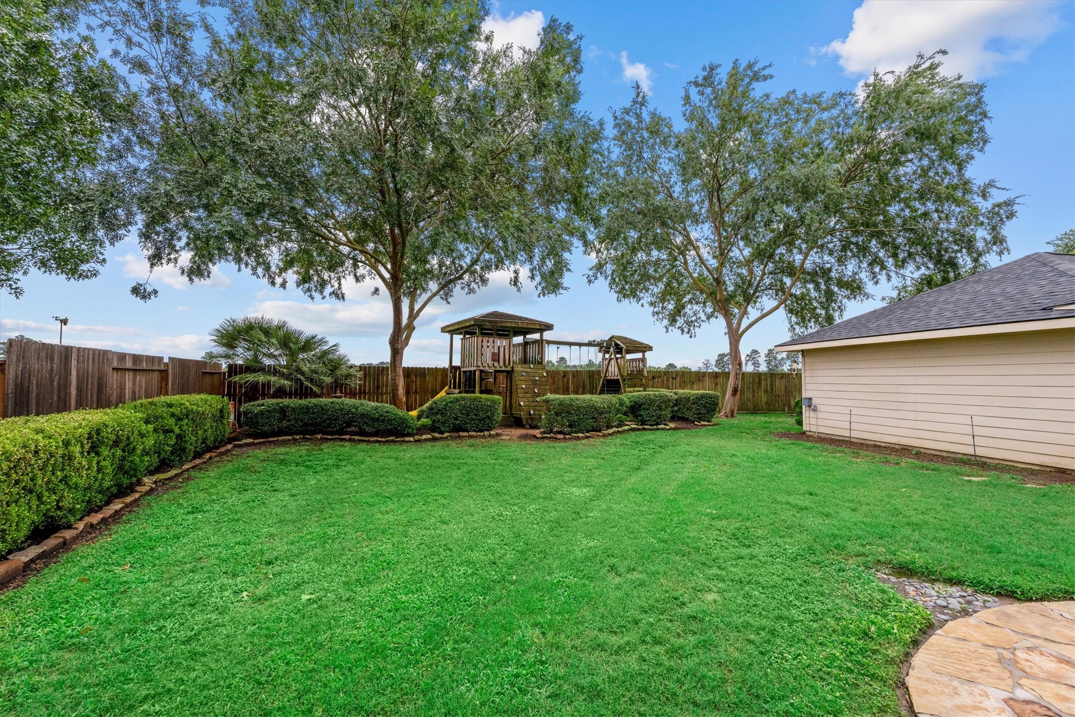 6323 Stone Trail Lane Spring, TX 77379 - Photo 29 of 43 a view of a house with backyard and garden