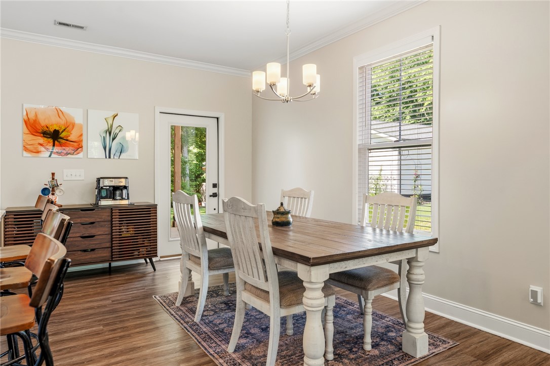 47 A Main Street Pelzer, SC 29669 - Photo 12 of 27 This dining area showcases elegant wood flooring and a refreshing open view to the outdoors.