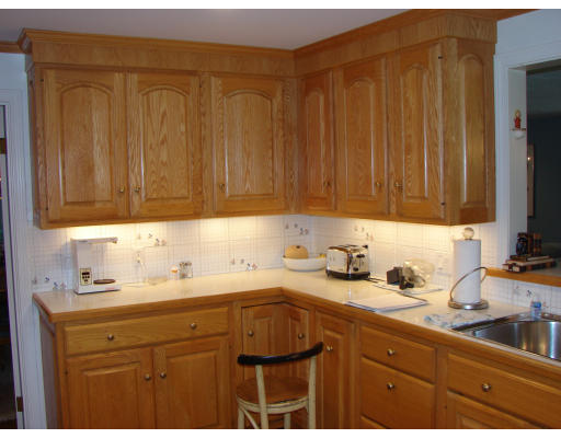 50 Aletha Road Needham, MA 02492 - Photo 4 of 12 a kitchen with a sink cabinets and utility