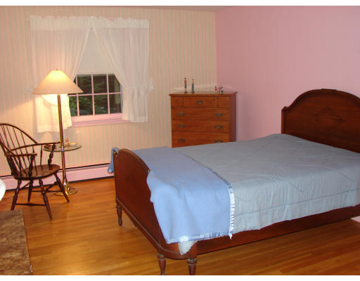 50 Aletha Road Needham, MA 02492 - Photo 9 of 12 a bedroom with a bed and a table