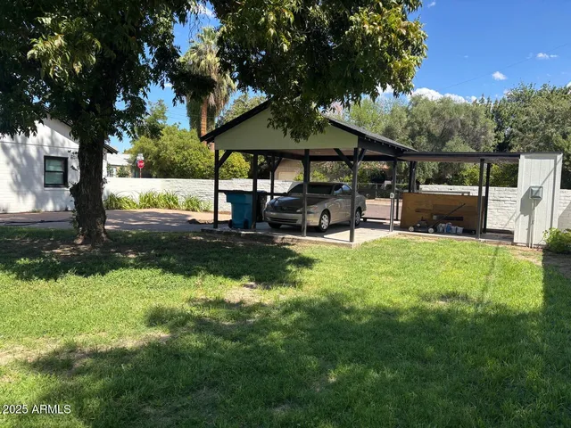 a view of a garden with patio