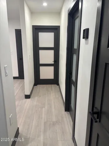 a bathroom with a granite countertop shower a toilet and a sink