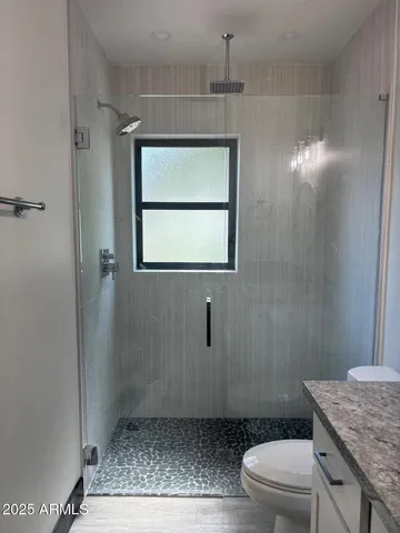 a view of a backyard with large trees