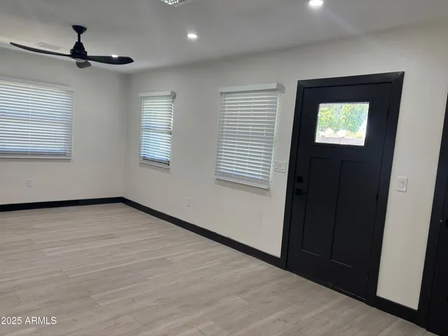 a view of an empty room with a window