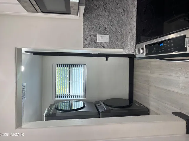 a bathroom with a sink and a window