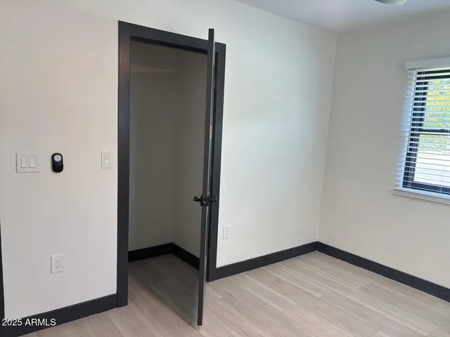 a view of a hallway with closet