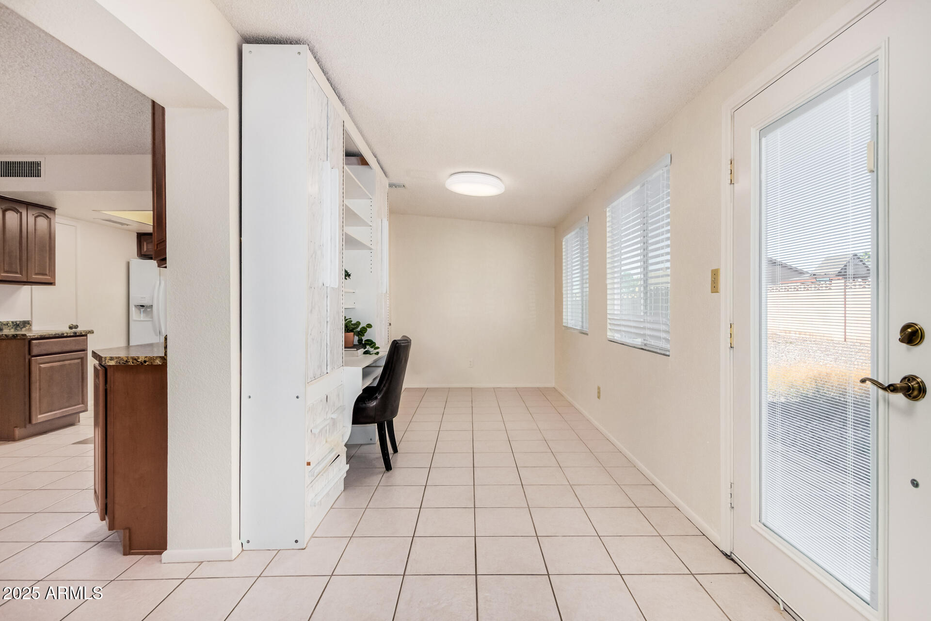 10512 West Ruth Avenue Peoria, AZ 85345 - Photo 19 of 33 a view of a room with wooden floor and a bathroom