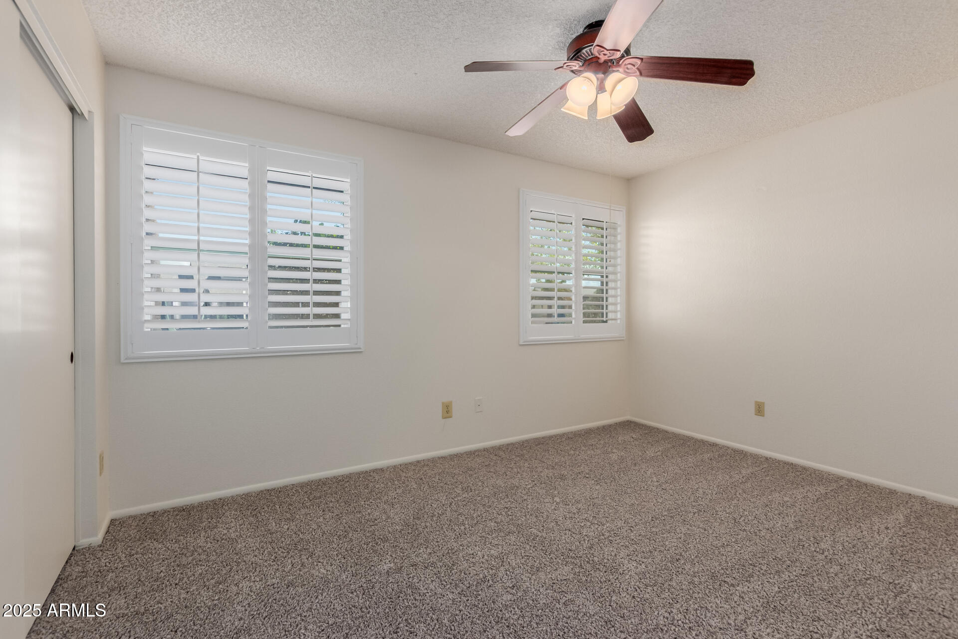 10512 West Ruth Avenue Peoria, AZ 85345 - Photo 20 of 33 a view of an empty room with a window