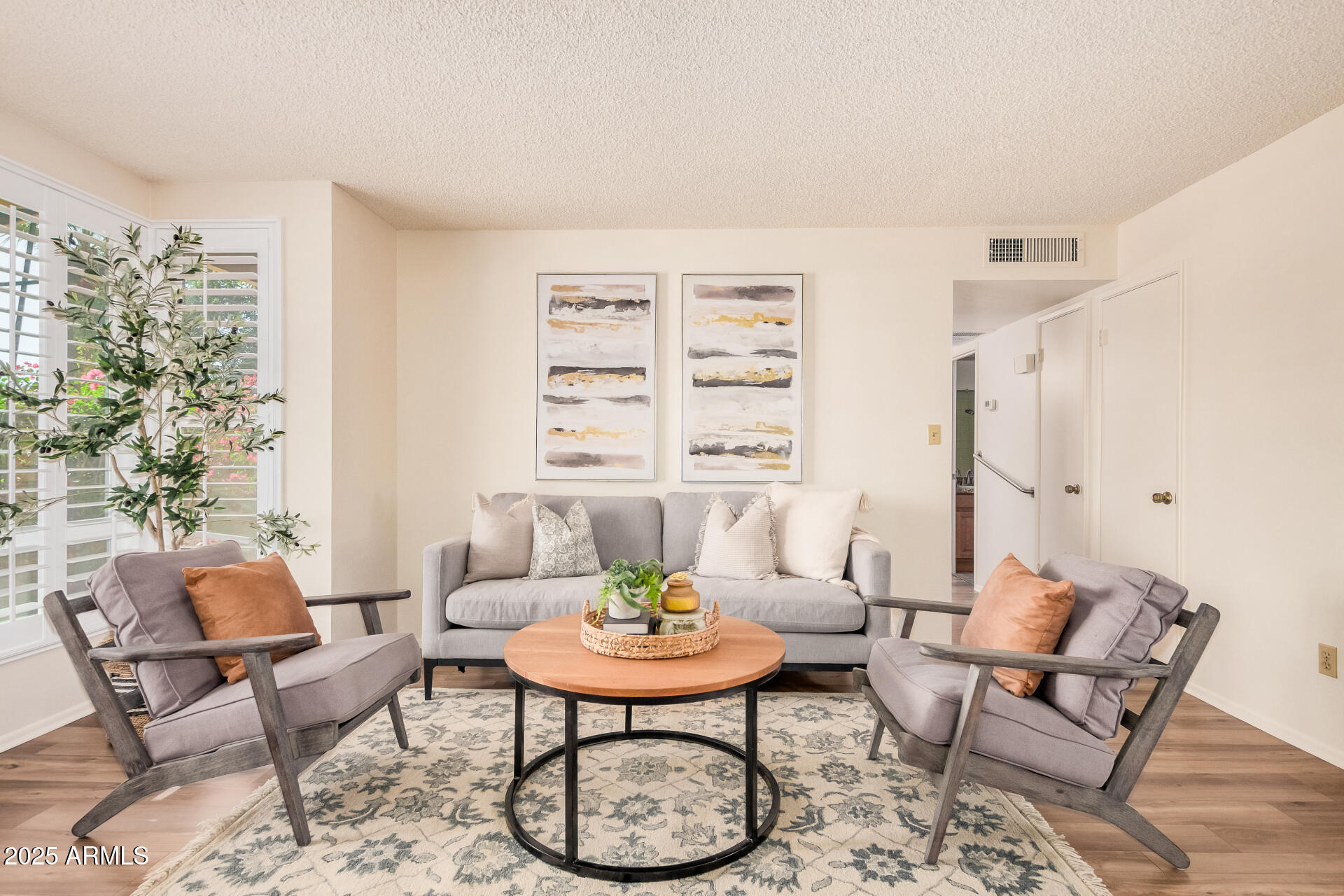 10512 West Ruth Avenue Peoria, AZ 85345 - Photo 2 of 33 a living room with furniture and a window