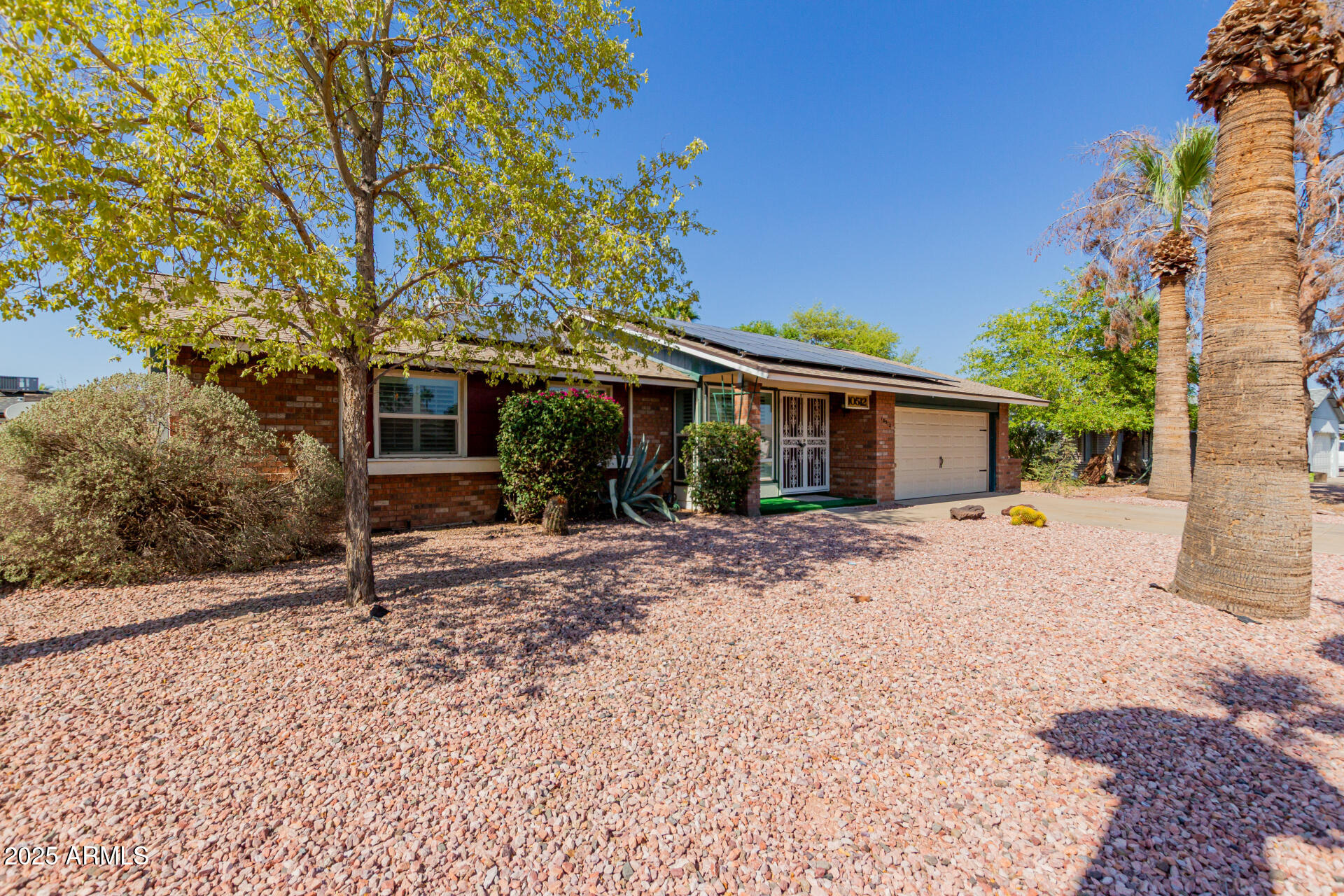 10512 West Ruth Avenue Peoria, AZ 85345 - Photo 28 of 33 a view of a house with backyard and a tree
