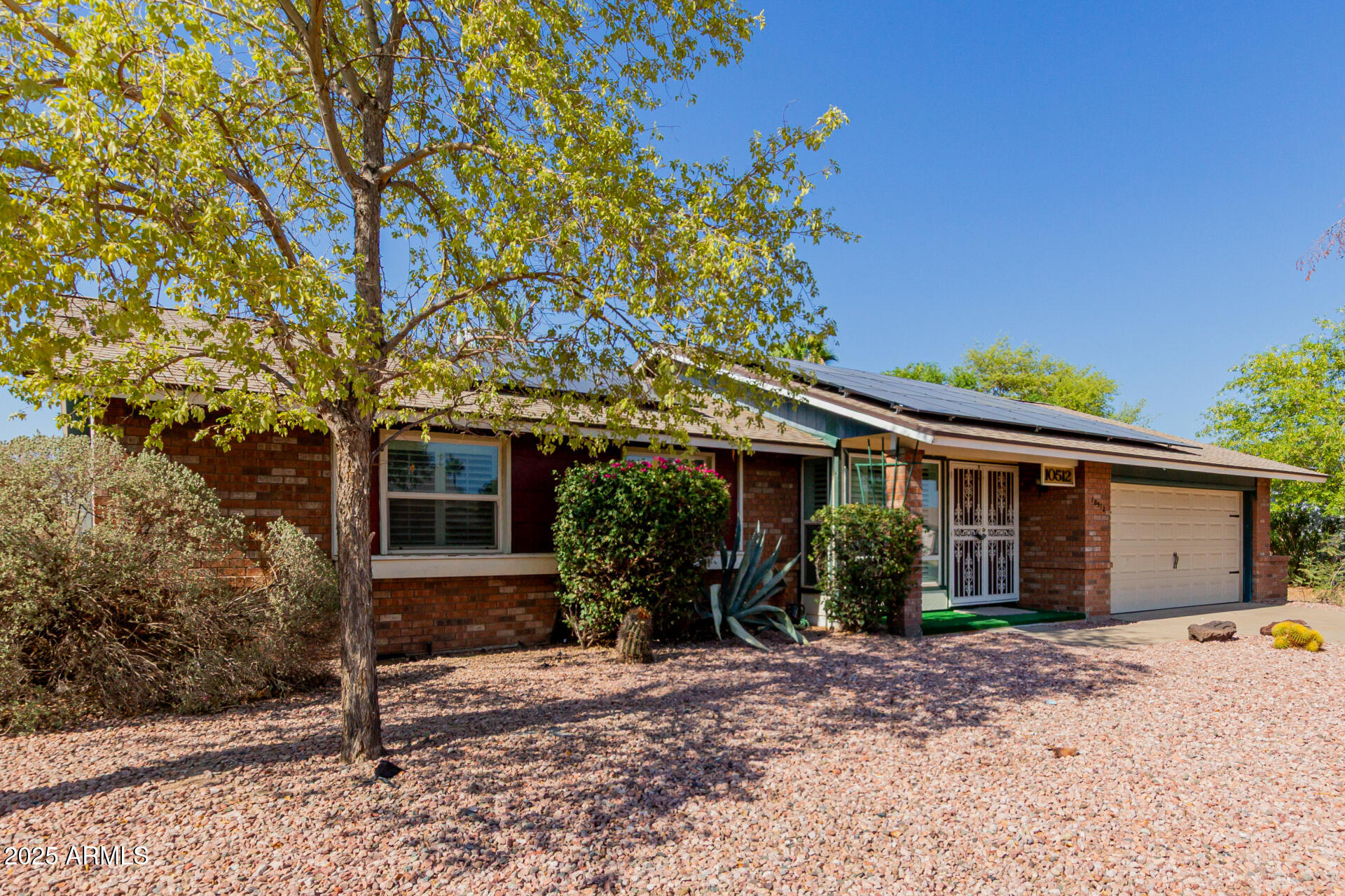10512 West Ruth Avenue Peoria, AZ 85345 - Photo 30 of 33 front view of a house with a tree in front