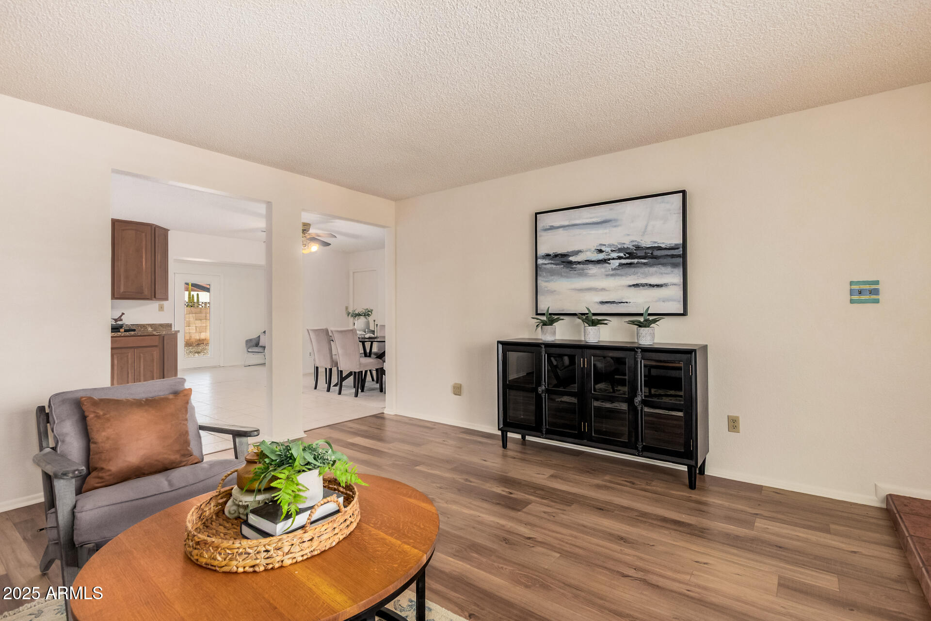 10512 West Ruth Avenue Peoria, AZ 85345 - Photo 3 of 33 a living room with furniture and a fireplace