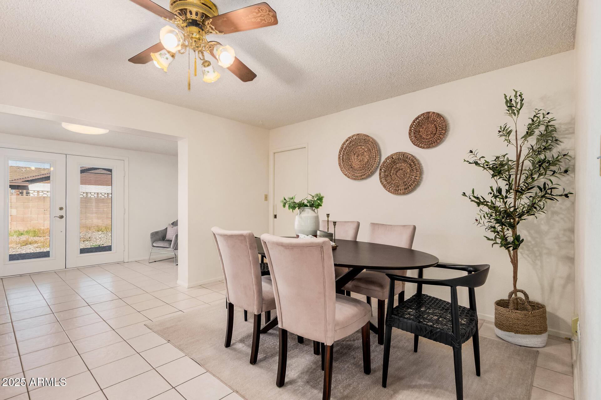 10512 West Ruth Avenue Peoria, AZ 85345 - Photo 4 of 33 a view of a dining room with furniture and chandelier