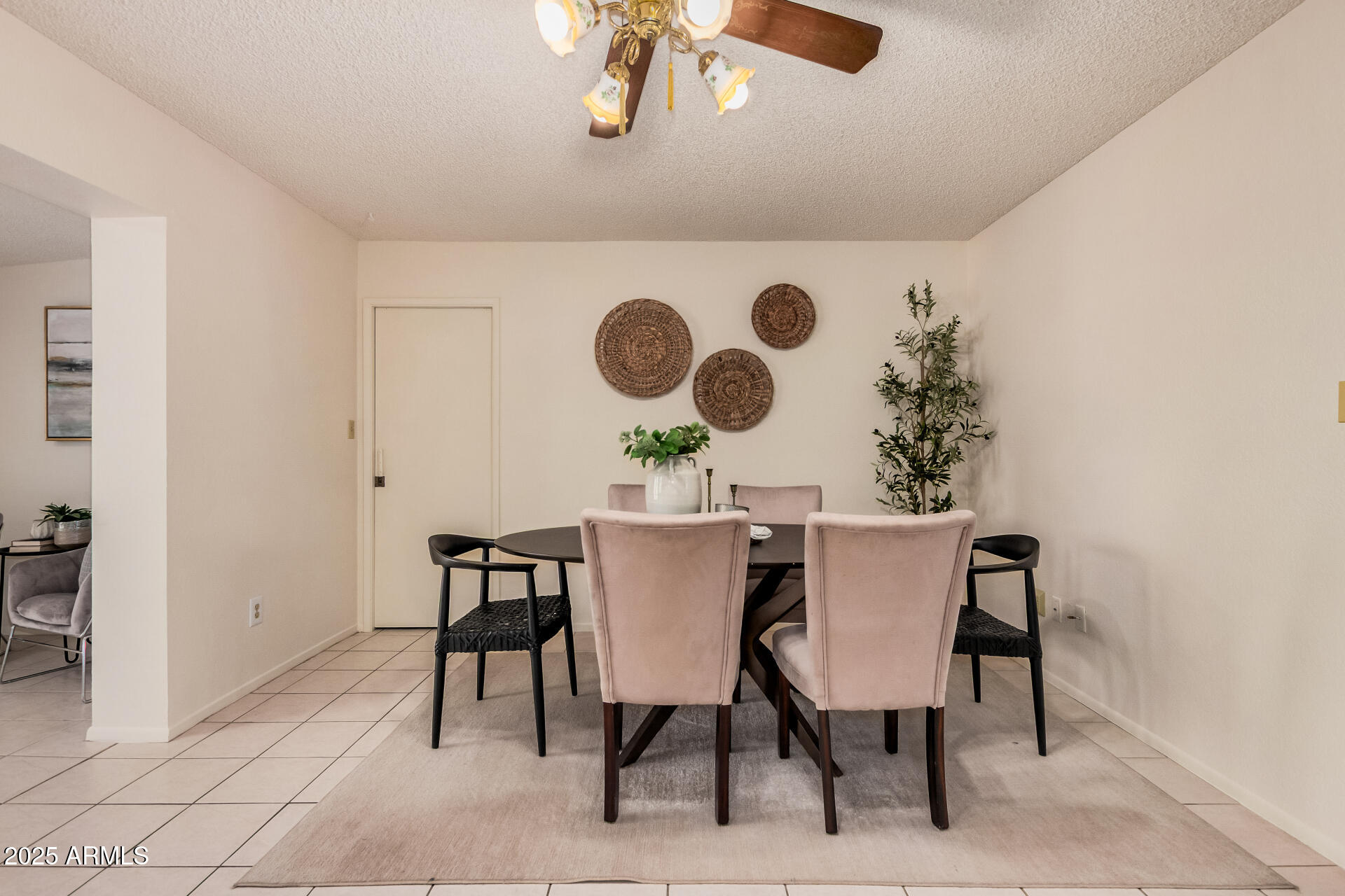 10512 West Ruth Avenue Peoria, AZ 85345 - Photo 5 of 33 a view of a dining room with furniture and chandelier