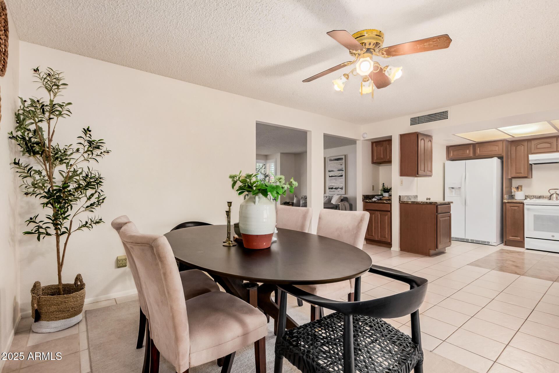10512 West Ruth Avenue Peoria, AZ 85345 - Photo 6 of 33 a view of a dining room with furniture and wooden floor