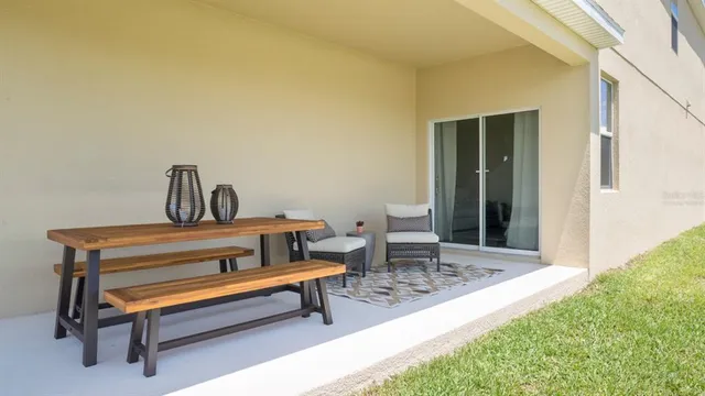 a wooden bench sitting in front of a house