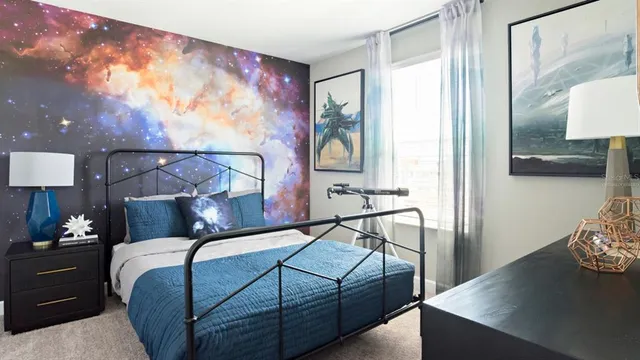 a bedroom with a bed and a painting on the wall