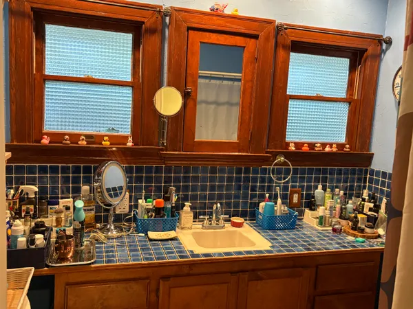 a view of walk in closet with clothes