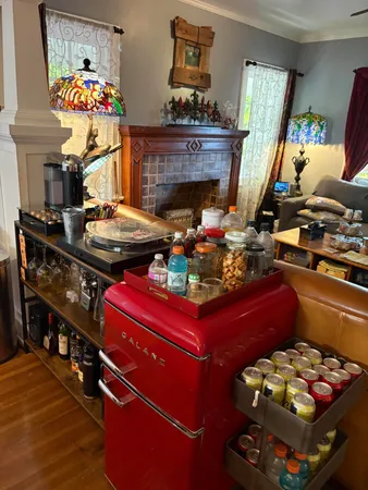 a living room with furniture and a fireplace