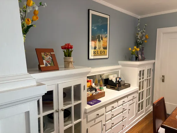a view of a patio with a table and chairs