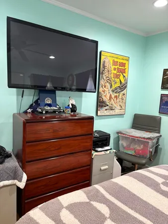 a room with furniture and a flat screen tv