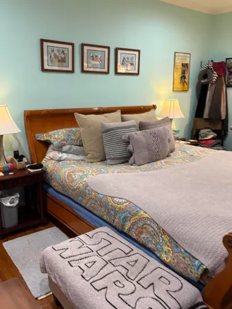 a bedroom with a bed and a couch