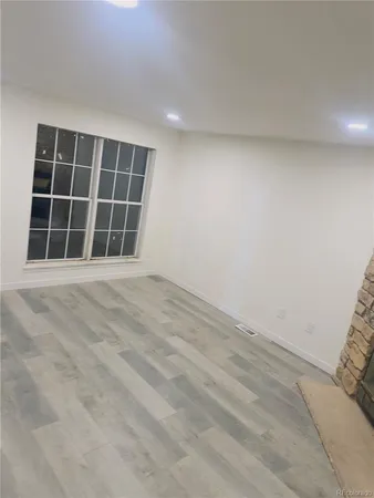a view of an empty room with a window