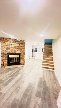 a view of an empty room with a fireplace