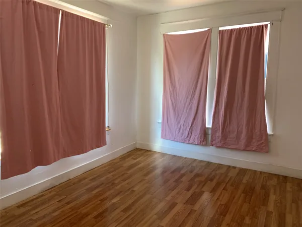 a view of a room with wooden walls