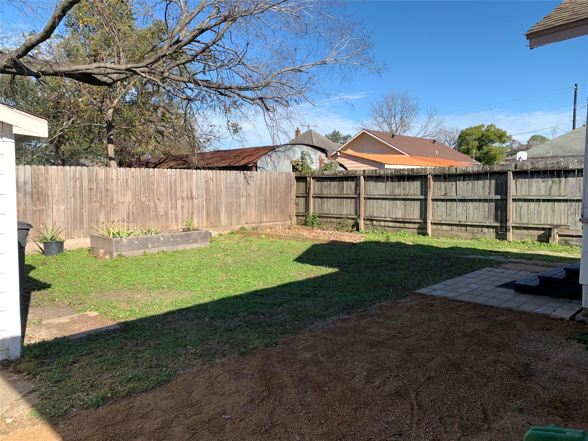 206 Cosmos Street Houston, TX 77009 - Photo 10 of 14 a view of a backyard with a garden
